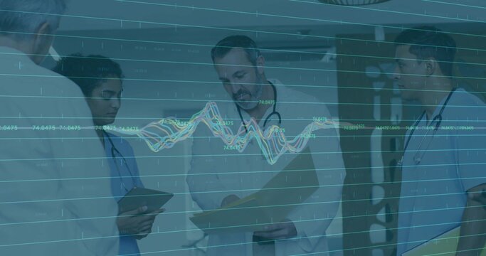 Examining medical team analyzing patient data overlay in hospital hallway, with tablets and charts