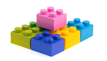 Obraz premium A brightly colored arrangement of plastic building blocks, stacked in an asymmetrical pyramid shape on a white background