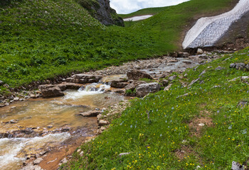mountain river canyon in summer, walking along the rocky shore