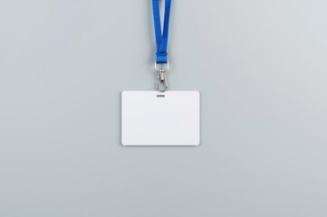 Blank identification card with blue lanyard on clean surface showcasing professional credentials