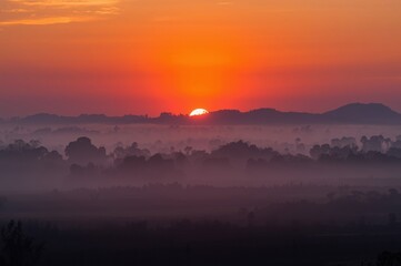 Enchanting Sunrise Over Misty Valleys, A Colorful Symphony of Nature's Serene Beauty