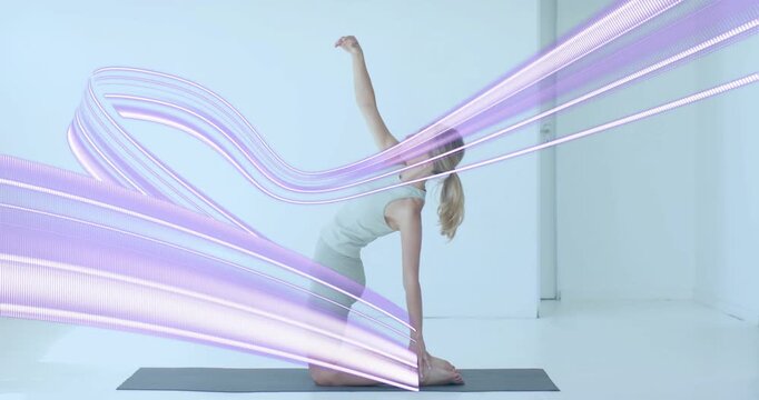 Yogi inhaling and engaging core, pushing hips into backbend with purple ribbons swirling for health