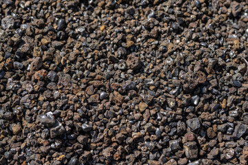 Scoria or cinder is a pyroclastic, highly vesicular, dark-colored volcanic rock formed by ejection from a volcano.  Crater Rim Drive (CLOSED) to Keanakako'i Overlook. Hawaiʻi Volcanoes National Park. 