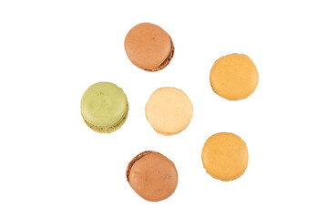 Macarons top view six pieces. Six colorful macarons photographed from above in green, beige, brown, and caramel. Arranged in a loose circle. Macaron on a transparent background.