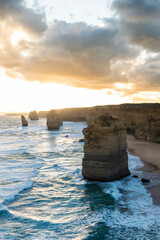 The shoreline with of the 12 Apostles in Victoria, Australia at a golden hour sunset