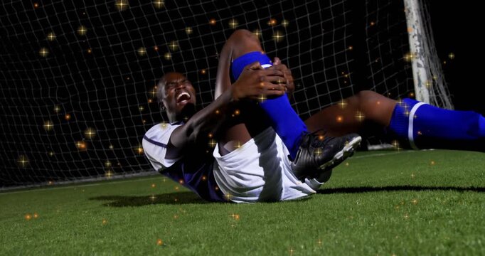 Soccer athlete sliding into frame triggers sparkles swirling around knee celebrating comeback