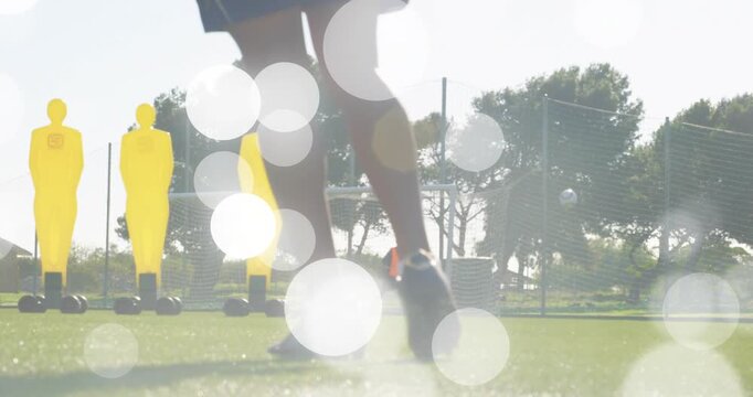 Soccer player approaching ball in training with animated path skimming past mannequins toward net