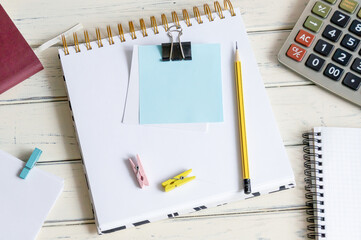 A blank post-it note on my notepad, next to my glasses and documents. Concept of business and finance. Calculator.
