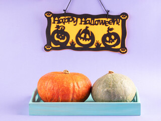 Happy halloween party ornament with pumpkins on purple background