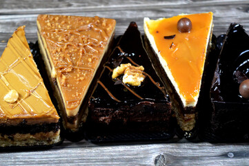 assorted cakes, mousse cake with caramel, coffee and chocolate flavors, creamy fudge cake and biscuit with whipped cream cakes, Mousse is a traditional French dessert called mousse, whipped cream