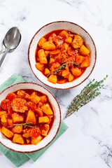 meat goulash with potatoes and carrots, sweet peppers, in a saucepan, top view, traditional Hungarian soup, homemade, no people,