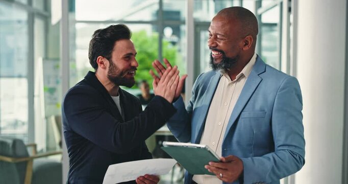 Business men, tablet or documents with high five for success, winning or teamwork at office. People, coworkers and celebration with smile, paperwork or technology for good news together at workplace