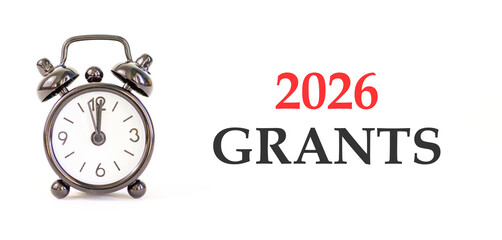 2026 Grants symbol. Concept words 2026 Grants on beautiful white paper. Beautiful white paper background. Beautiful black alarm clock. Business and 2026 grants concept. Copy space.