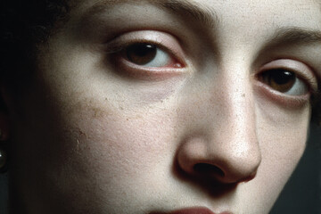 Mysterious portrait in the style of a mystical carnival, close-up of a woman with a mask covering her face, the aesthetics of decadence and mystery, art style