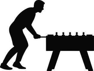 Silhouette of a Man Playing a Game of Table Football (Foosball)