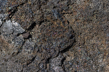 volcanic rocks / Lava have rainbow colors on their surface. Puna Basalt Lava flows, A.D. 1974. Keanakako'i Overlook. Hawaiʻi Volcanoes National Park.