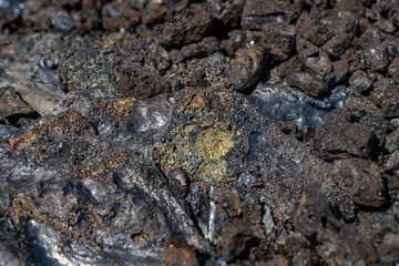 volcanic rocks / Lava have rainbow colors on their surface. Puna Basalt Lava flows, A.D. 1974. Keanakako'i Overlook. Hawaiʻi Volcanoes National Park.