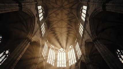 Divine Light Streaming Through Grand Stained-Glass Window in Majestic Gothic Cathedral Interior, Highlighting Sacred Serenity and Historic Grandeur - Powered by Adobe