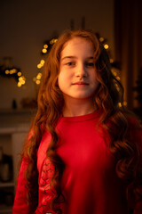 Candid Portrait of a Young Girl in Red Pajamas with Wavy Hair, Warm Bokeh Lights Background