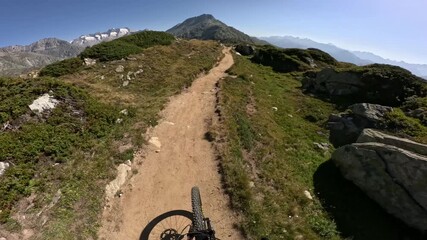 POV of mountain biker riding a dangerous singletrack trail in the Swiss alps - Powered by Adobe