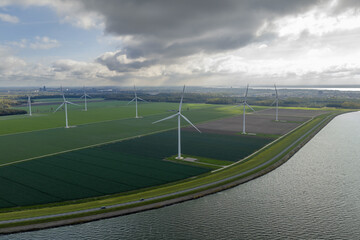 Aerial view on energy farm with wind mills generating sustainable green electricity in Flevoland, the Netherlands
