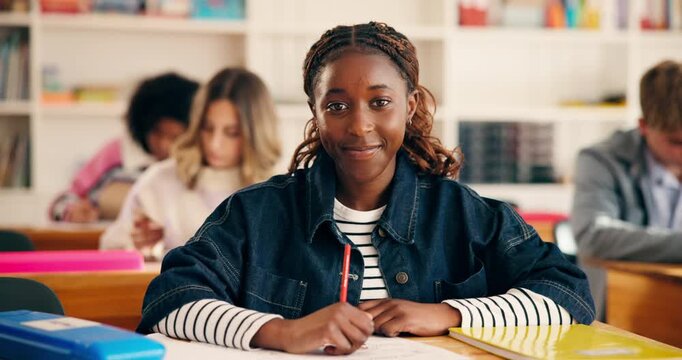 Smile, face and teenager in high school with writing test, exam or assessment for education. Happy, learning and portrait of girl student with books for notes for studying in classroom at campus.