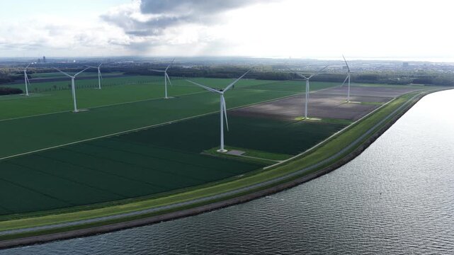 Aerial view on energy farm with wind mills generating sustainable green electricity in Flevoland, the Netherlands