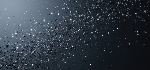 Obraz premium Tiny particles float and glimmer in the darkness