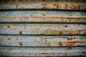 The surface of the metallic blue background. Old metal with worn paint.