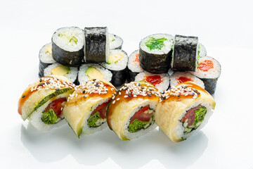 Delicious sushi rolls featuring fresh ingredients, skillfully arranged for a vibrant presentation