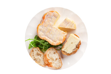 Washed rind cheese soft cheese with orange rind munster french cheese tasty snack fresh delicious gourmet food background on the table rustic top view copy space