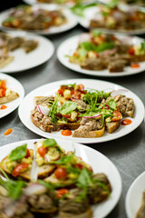 Delicious open-faced sandwiches with fresh greens and tomatoes make a vibrant guest treat