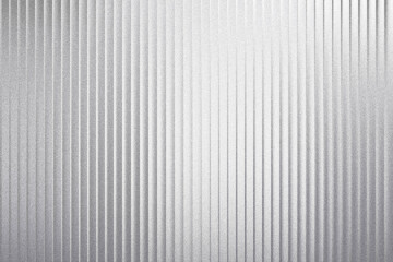 Shiny silver corrugated metal sheet with vertical lines isolated on white background
