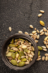Seed mix sunflower seeds and pumpkin seeds natural product tasty snack fresh delicious gourmet food background on the table rustic top view copy space keto and paleo diet vegan and vegan food