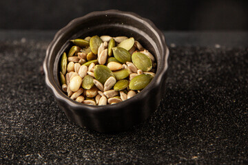 Seed mix sunflower seeds and pumpkin seeds natural product tasty snack fresh delicious gourmet food background on the table rustic top view copy space keto and paleo diet vegan and vegan food