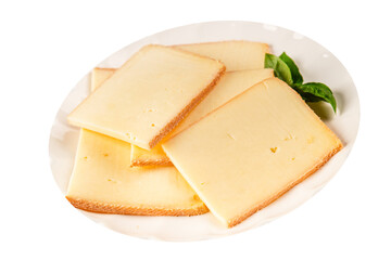 Raclette cheese portion slicing natural product tasty snack fresh delicious gourmet food background on the table rustic top view copy space