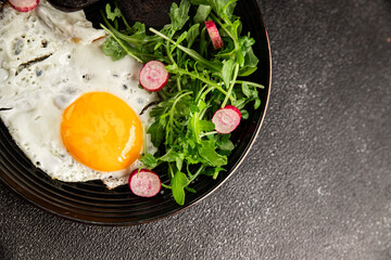 Eggs breakfast black pudding, egg, vegetables, arugula portion size natural product tasty snack fresh delicious gourmet food background on the table rustic top view copy space