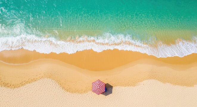 Aerial View of Tropical Beach with Turquoise Water and Red Striped Umbrella