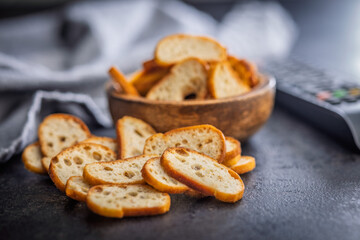 Crispy roasted bruschetta bread on black table.