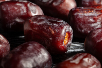 dates fruit on black wood background