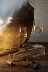 An abstract and modern art still life of a glass of wine, featuring a dynamic composition of light, shadow, and form.