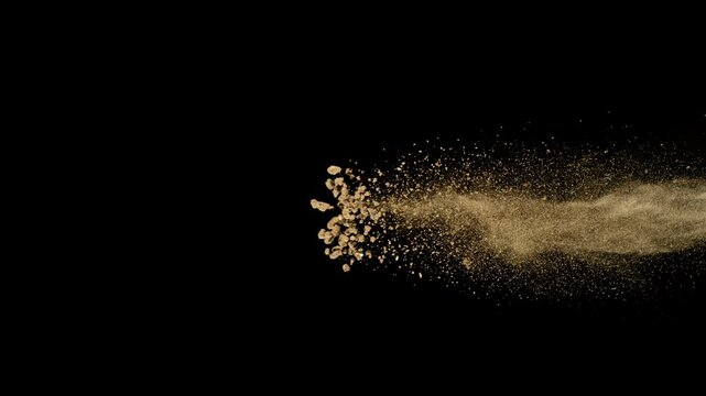 Super Slow Motion Shot of Flying Soil , Isolated on Black Background , Filmed on High Speed Cinematic Camera at 1000 FPS