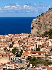 Obraz premium Cefalu, a historic Sicilian coastal town in northern Sicily, Italy, charming narrow streets, the Cathedral Basilica of the Transfiguration of the Lord, golden beach, and view of the Tyrrhenian Sea