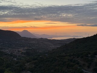 Fototapeta premium Collesano, a historic Sicilian mountain town in the Madonie Mountains, featuring narrow stone streets, traditional houses, and the Church of San Pietro, Sicily, Italy. Italian town in hills