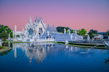 White temple wat rong khun in Chiang Rai, Thailand at sunset