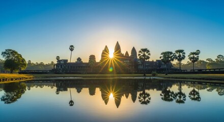Fototapeta premium Sunrise over angkor wat reflecting in tranquil waters
