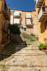 Castelbuono medieval town in the Madonie Mountains, Sicily, Italy, basking under the summer sun with historic streets, Ventimiglia Castle. Old mountain town in Sicily. Italian town in hills