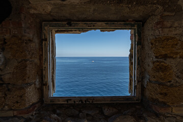 Capo Zafferano Italian coastal promontory and lighthouse by the Tyrrhenian Sea in Bagheria, Sicily Italy with rugged cliffs lush Mediterranean flora crystal clear water