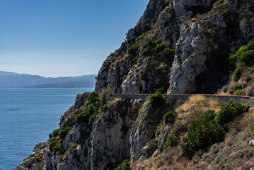 Obraz premium Capo Zafferano Italian coastal promontory and lighthouse by the Tyrrhenian Sea in Bagheria, Sicily Italy with rugged cliffs lush Mediterranean flora crystal clear water