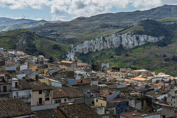 Naklejka premium Caltavuturo, a historic Sicilian mountain town in the Madonie Mountains, featuring its medieval castle, charming narrow streets, and traditional stone houses, Sicily, Italy. Italian town in hills